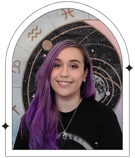 Ellie the Moonchild looks to the camera with a gentle smile, with a celestial background. The image has a warm, inviting tone that reflects the reflective and compassionate approach to tarot readings offered by Ellie.